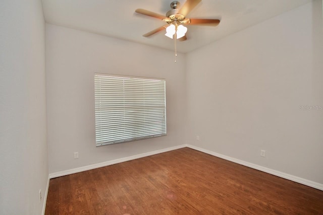 unfurnished room with ceiling fan and dark hardwood / wood-style flooring