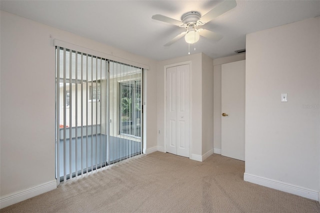 unfurnished room with light carpet and ceiling fan