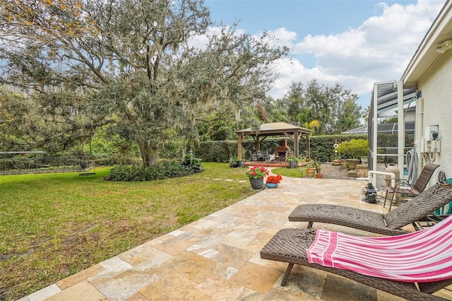 view of patio with a lanai and a gazebo