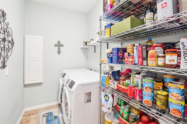 clothes washing area featuring washer and dryer