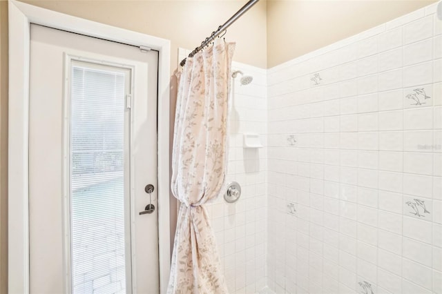 bathroom with a shower with shower curtain