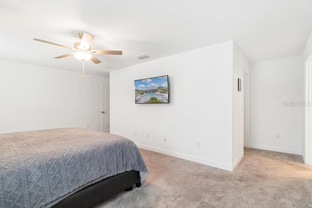 bedroom featuring light carpet and ceiling fan