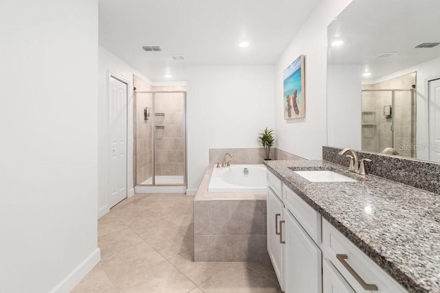 bathroom featuring vanity, separate shower and tub, and tile patterned flooring