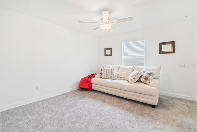 carpeted living room featuring ceiling fan