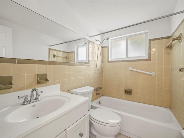 full bathroom featuring toilet, tasteful backsplash, tiled shower / bath, and vanity