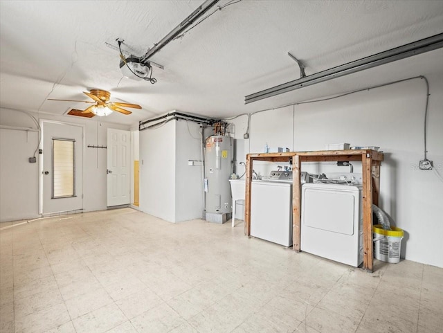 interior space with sink, washing machine and dryer, and water heater