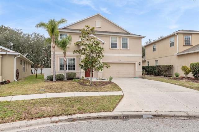 view of front of property with a garage and a front lawn