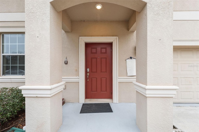 property entrance with a garage