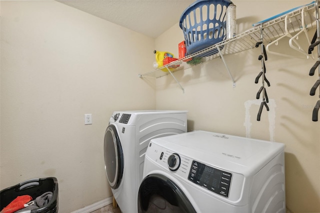 laundry room with separate washer and dryer