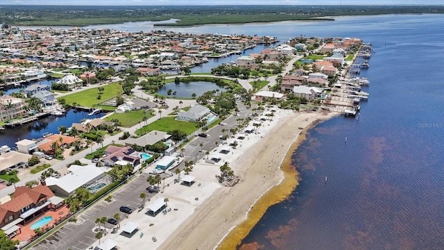 aerial view featuring a water view and a beach view