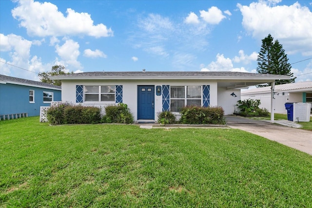 ranch-style house with a front lawn and a carport