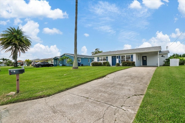 single story home featuring a carport and a front lawn