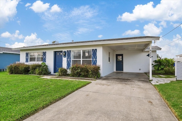 ranch-style house with a carport and a front lawn