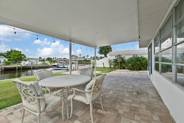 view of patio with a water view