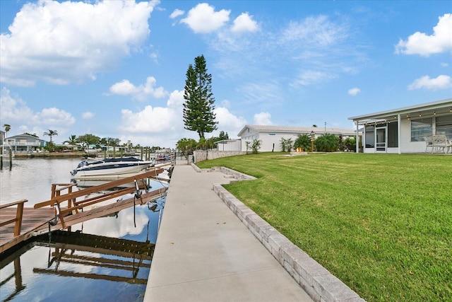 dock area featuring a water view and a yard