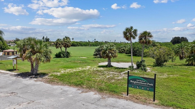 surrounding community featuring a rural view and a yard