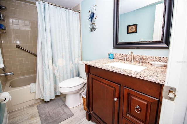 full bathroom featuring vanity, wood-type flooring, toilet, and shower / bathtub combination with curtain