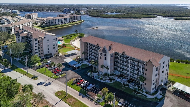 birds eye view of property featuring a water view