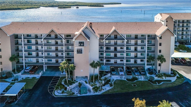 birds eye view of property with a water view