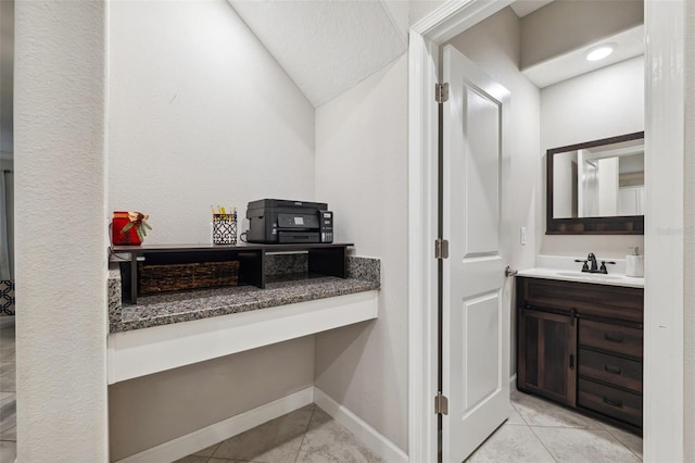 bathroom featuring tile patterned floors and vanity