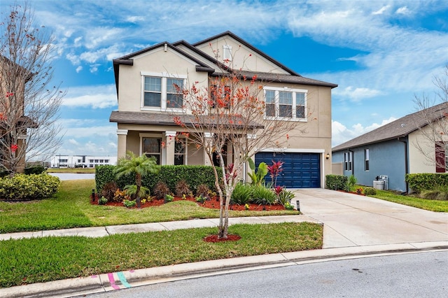 view of front of home featuring a garage and a front lawn