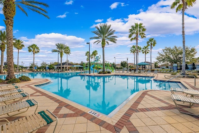 view of pool with a patio area and a water slide