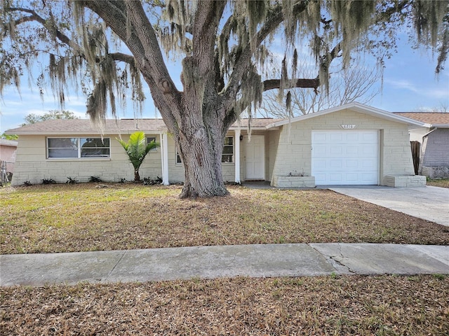 single story home featuring a garage and a front yard