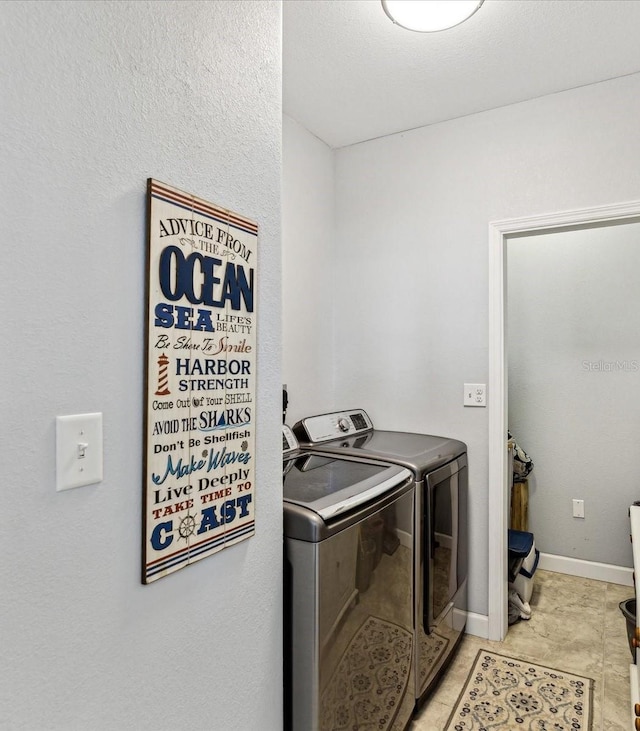 clothes washing area with independent washer and dryer