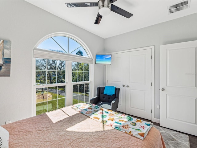 bedroom featuring ceiling fan and a closet