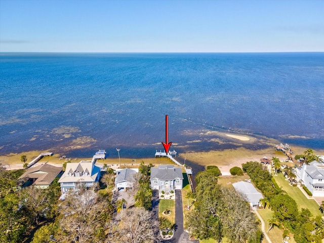 birds eye view of property featuring a water view