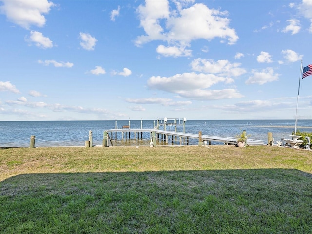 exterior space featuring a water view and a yard