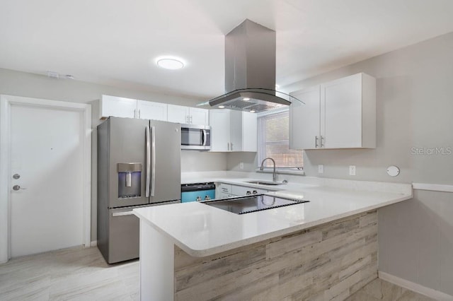 kitchen featuring white cabinetry, island range hood, kitchen peninsula, and appliances with stainless steel finishes