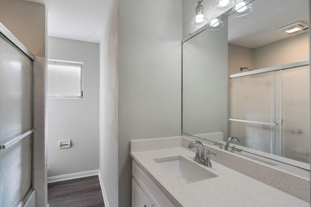 bathroom with vanity and wood-type flooring