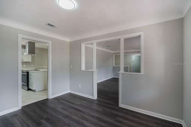 unfurnished room featuring dark hardwood / wood-style floors