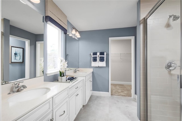 bathroom with vanity and a shower with shower door