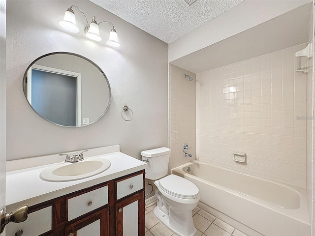 full bathroom with tile patterned flooring, vanity, a textured ceiling, toilet, and tiled shower / bath