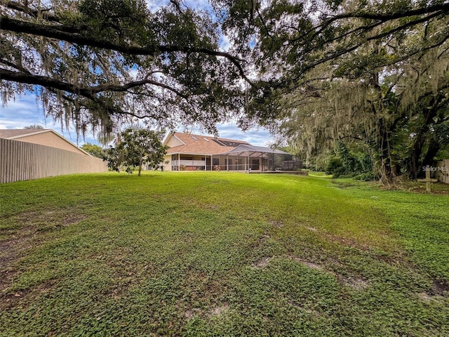 view of yard featuring a lanai