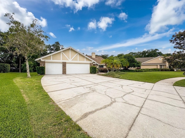 view of front of property featuring a garage and a front yard