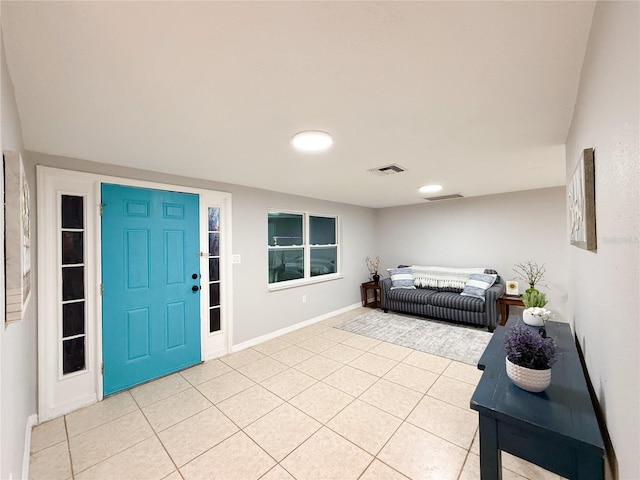 foyer featuring light tile patterned flooring