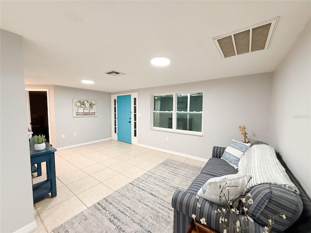 living area featuring light tile patterned flooring