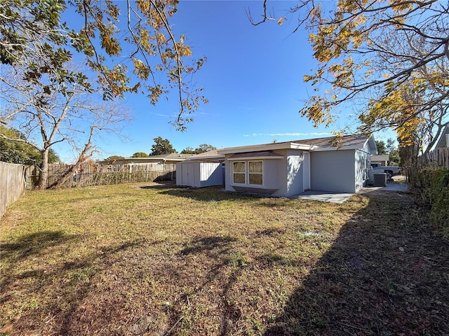 rear view of property featuring a yard