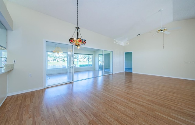 interior space with high vaulted ceiling, light hardwood / wood-style floors, and ceiling fan