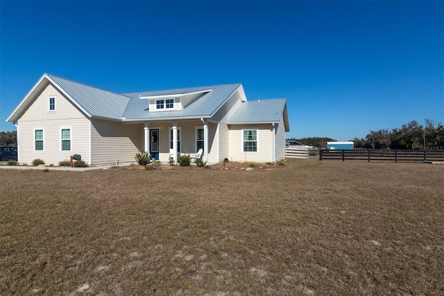 view of front of house featuring a porch and a front lawn