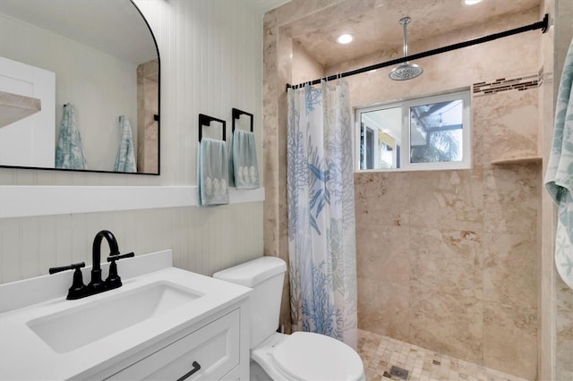 14124 Kulig Ct, Hudson, FL 34667 - bathroom featuring toilet, tiled shower, and vanity