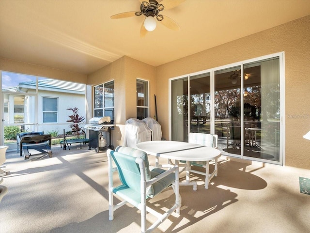 view of patio / terrace with area for grilling and ceiling fan