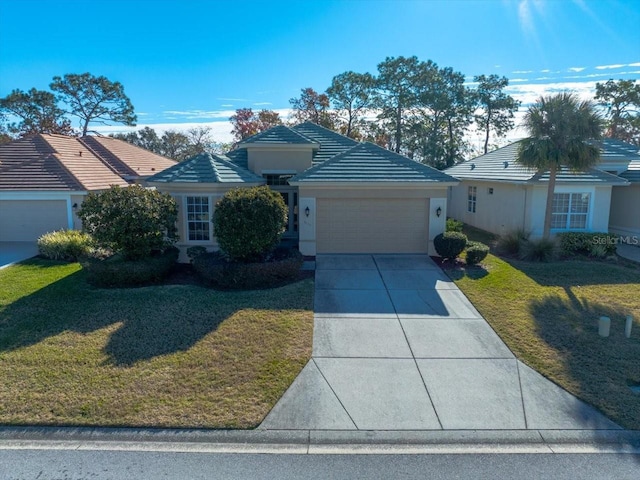 ranch-style home with a garage and a front lawn