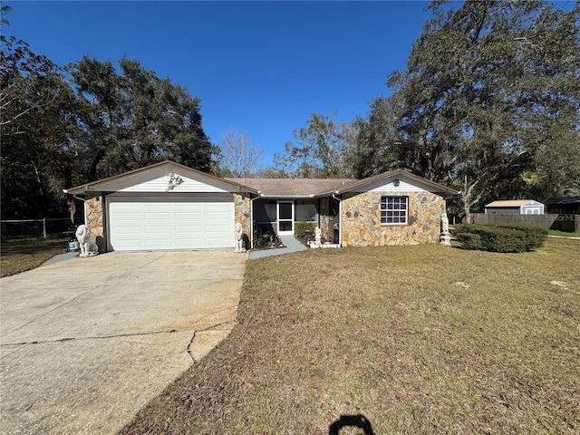 ranch-style house featuring a garage and a front lawn