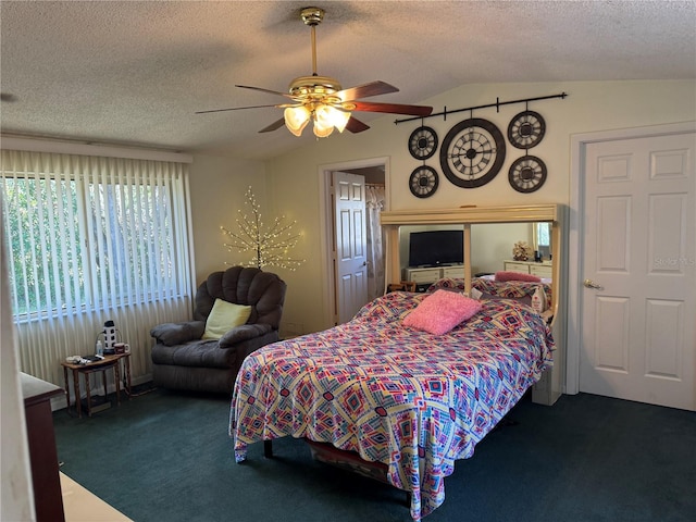 carpeted bedroom with lofted ceiling, a textured ceiling, and ceiling fan