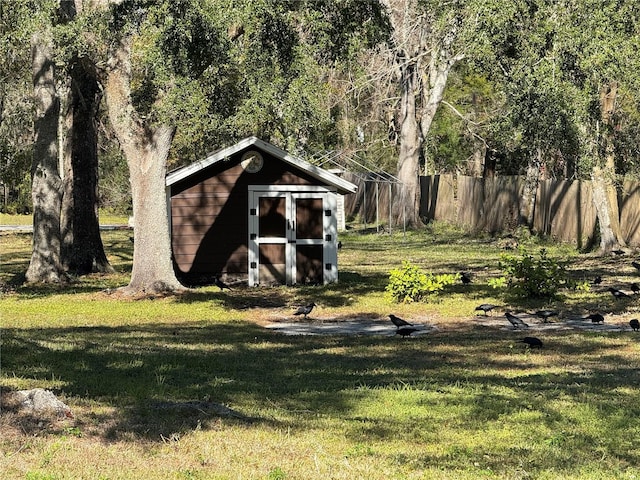 view of outbuilding featuring a yard