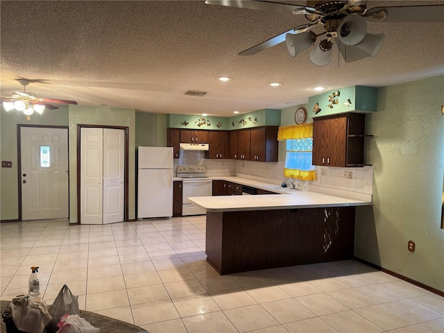 kitchen with sink, backsplash, light tile patterned floors, kitchen peninsula, and white appliances